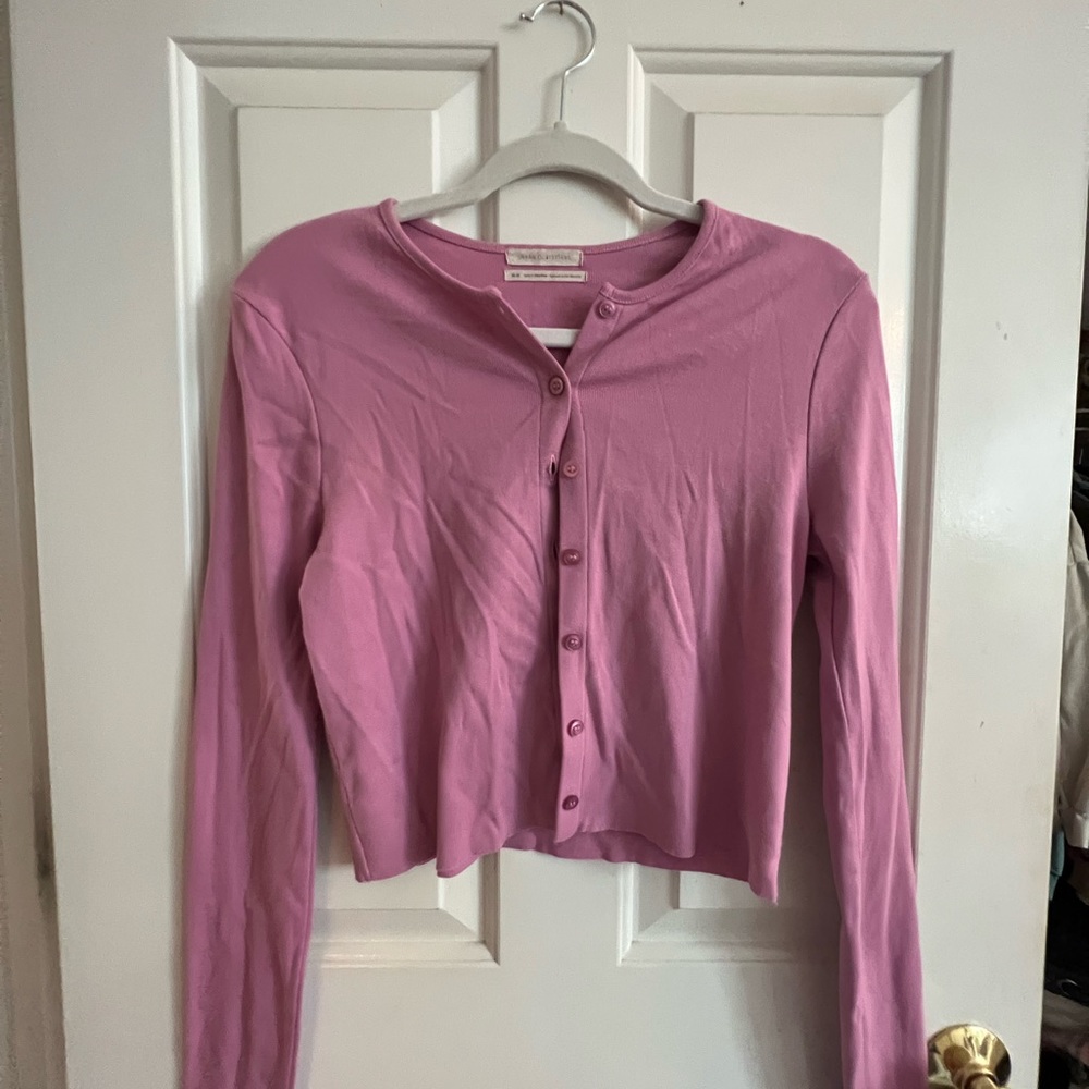Urban Outfitters pink cropped cardigan.